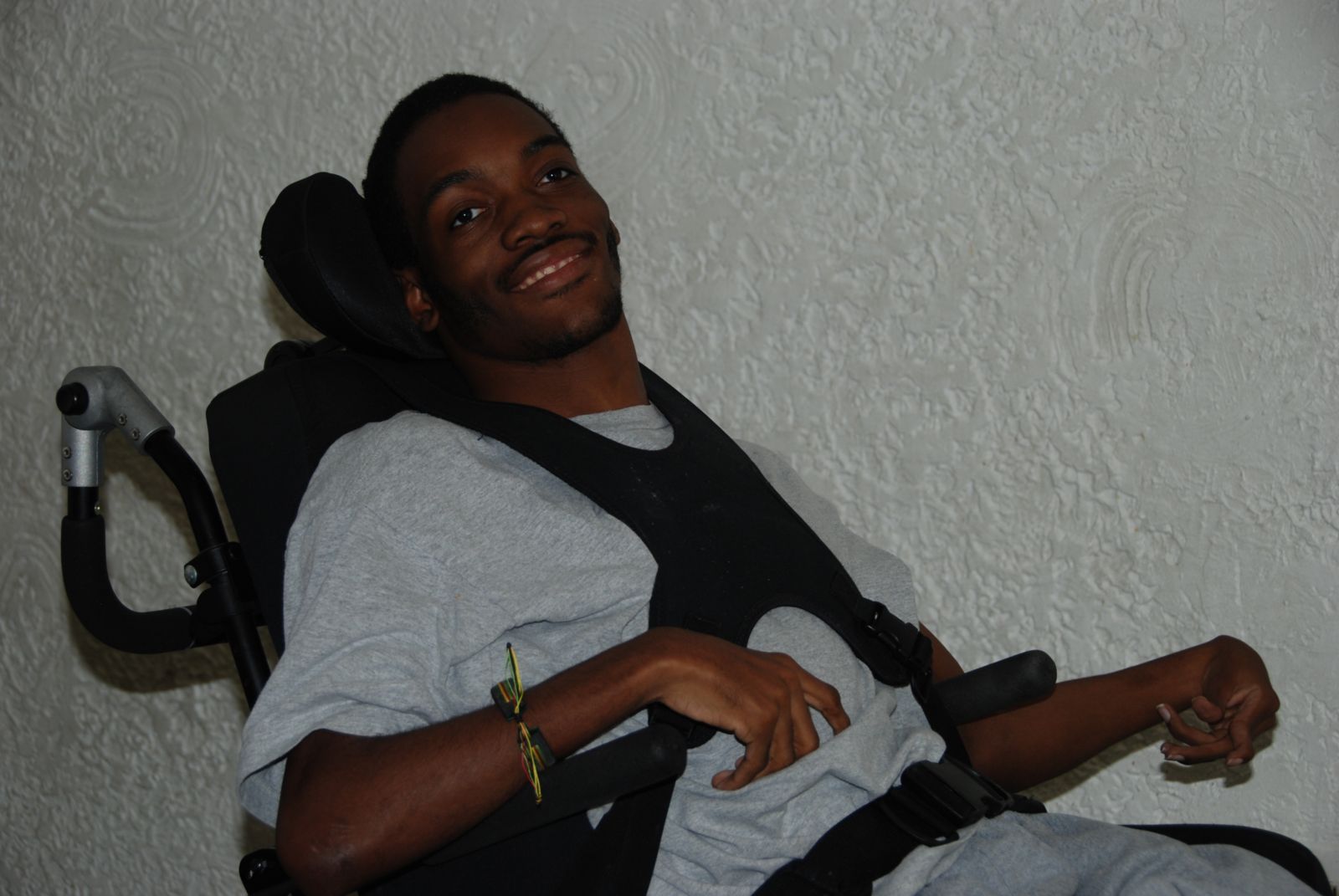man in wheelchair smiling