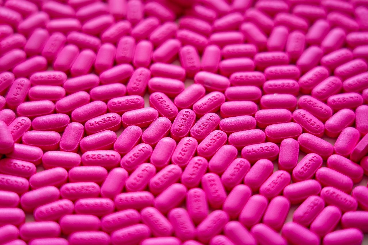 purple pills on a table